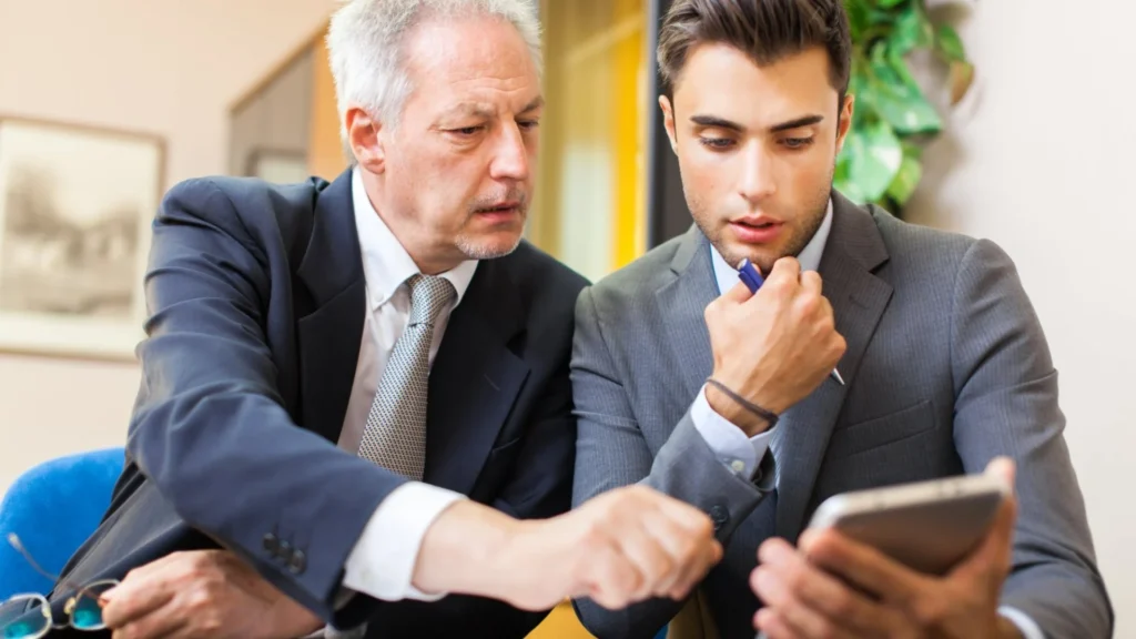 A young employee getting mentored from his senior manager